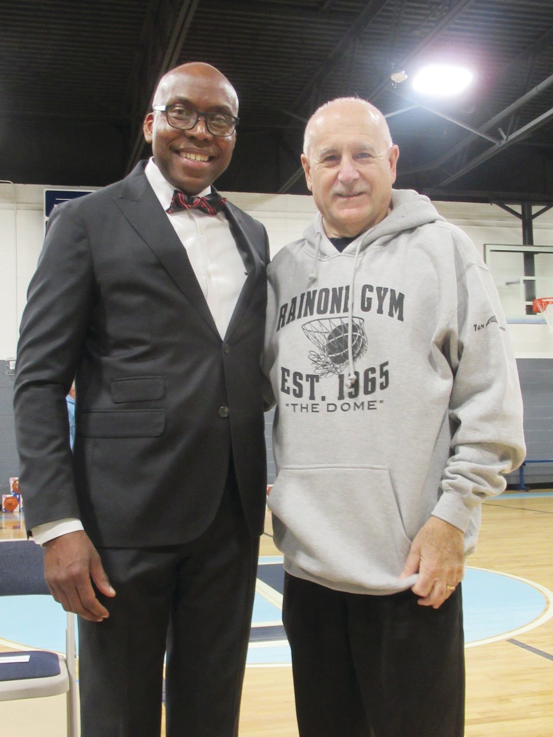 SPECIAL SPEAKERS: Pastor Chris Abhulime of King’s Tabernacle Church in Johnston joins his friend Mayor Joseph Polisena during Saturday’s re-dedication of Rainone Gym.